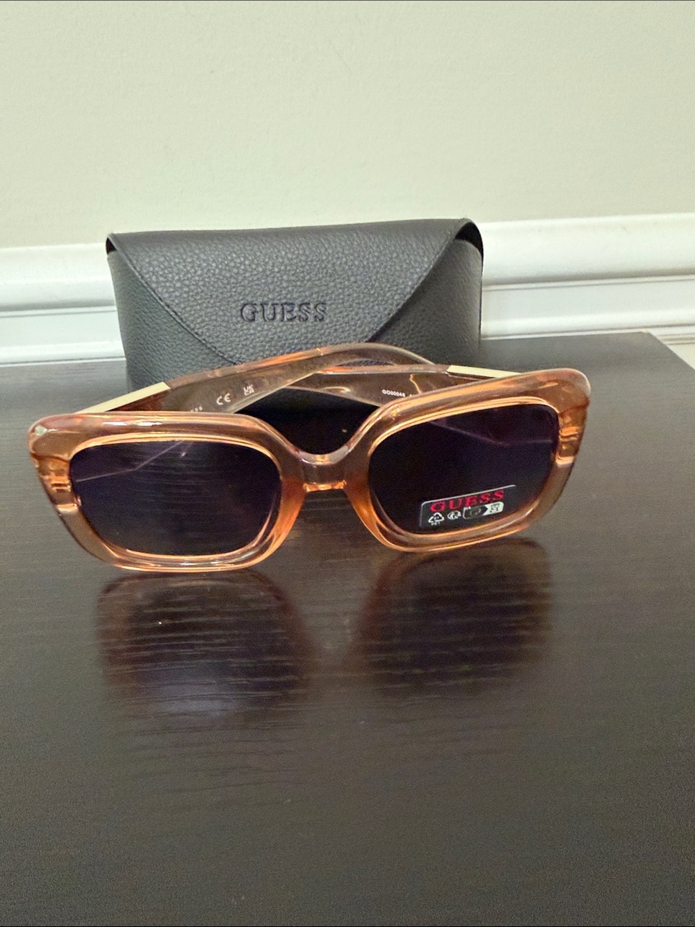 GUESS Women’s Square Sunglasses in Translucent peach  with Dark Lenses